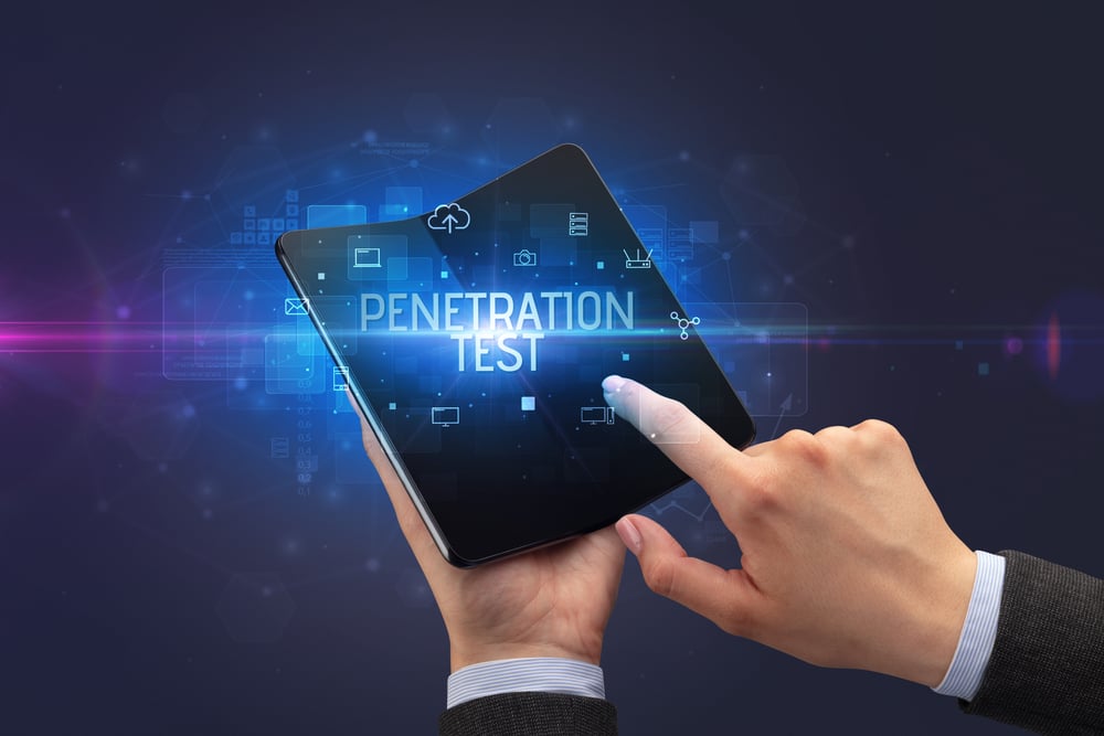 Businessman,Holding,A,Foldable,Smartphone,With,Penetration,Test,Inscription,,Cyber penetration testing for financial institutions